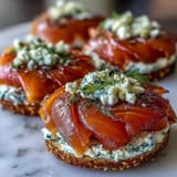 Impressive smoked salmon bagel board featuring creamy spreads and fresh veggies, perfect for effortless entertaining.