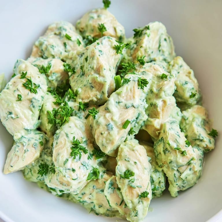 Colorful avocado ranch chicken salad served in a rustic bowl, perfect for quick lunches or light dinners.
