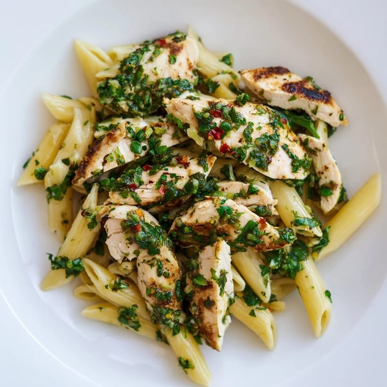 Hearty Chimichurri Chicken Pasta with fresh parsley, garlic, and a drizzle of tangy red wine vinegar.  